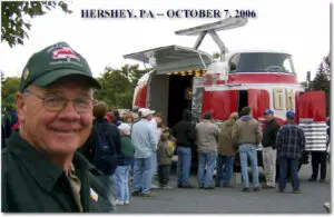 Don Mayton in front of the restored Futurliner at a fair