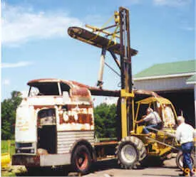Hi Low tractor removing rusted Futurliner roof