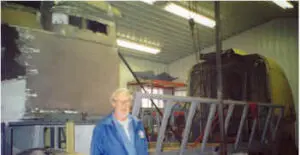 Man in front of disassembled Futurliner
