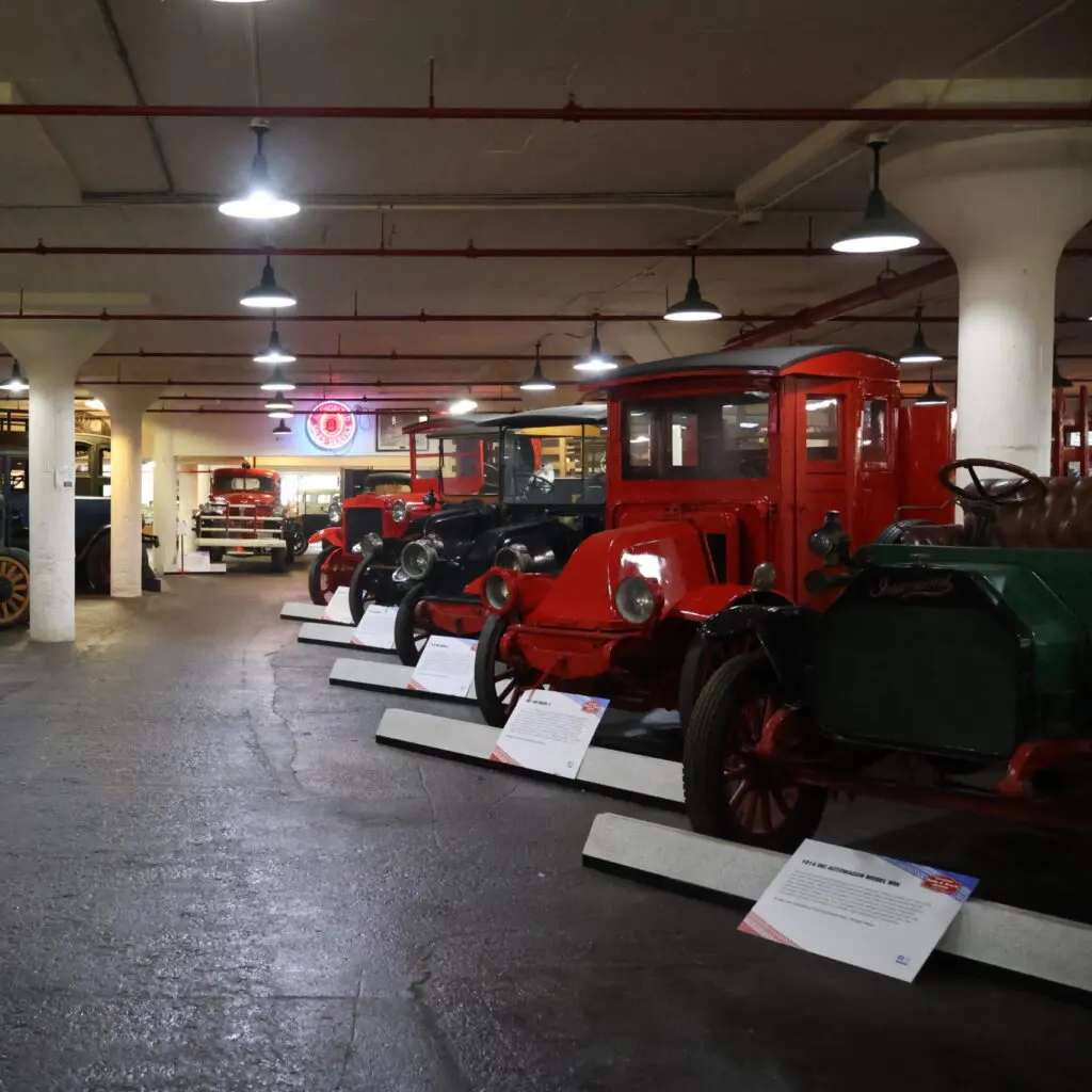 Lineup of old American trucks in the basement of NATMUS